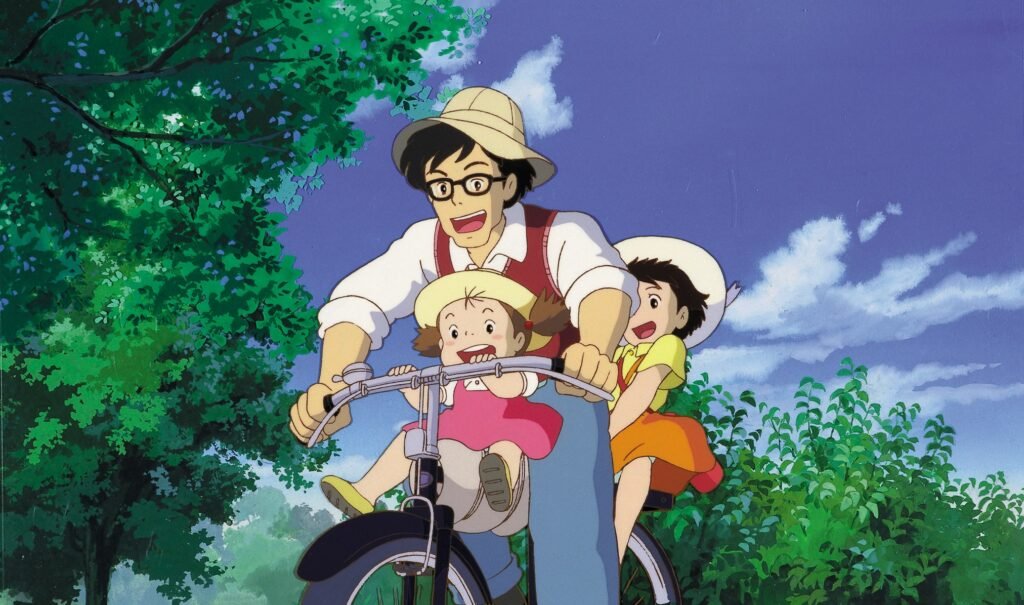 Mei, Satsuki y su padre Tatsuo en bicicleta