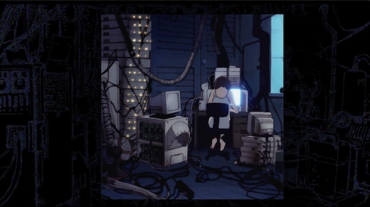 Lain sentada de espalda frente a su computadora 